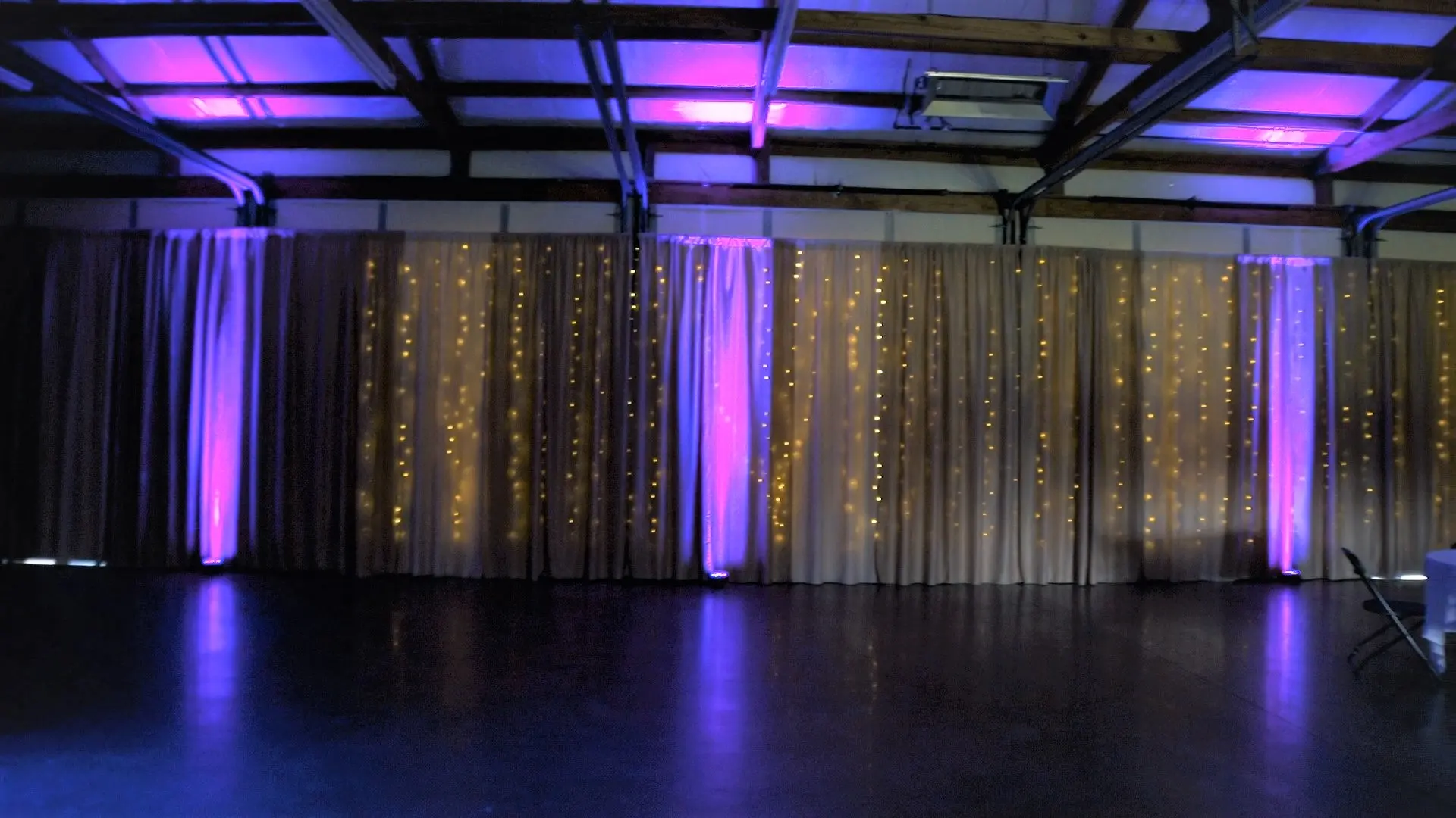 Wedding reception space with event uplighting